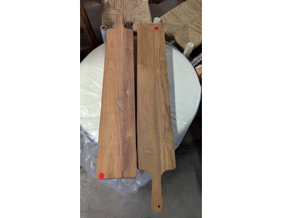 Pair of wooden serving boards featuring natural wo...
