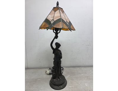 Elegant Tiffany-style table lamp featuring a figur...