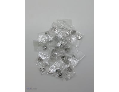 COLLECTION OF HEART SHAPED SILVER COLOURED CHARMS
...