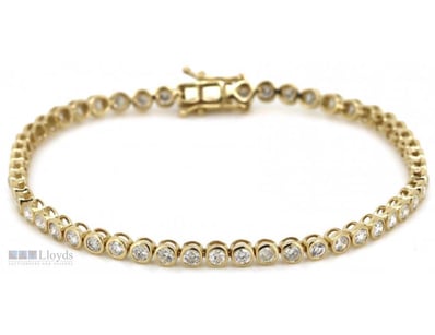 14CT YELLOW GOLD AND DIAMOND TENNIS BRACELET

Th...
