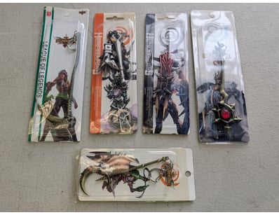 Collection of five licensed gaming merchandise key...