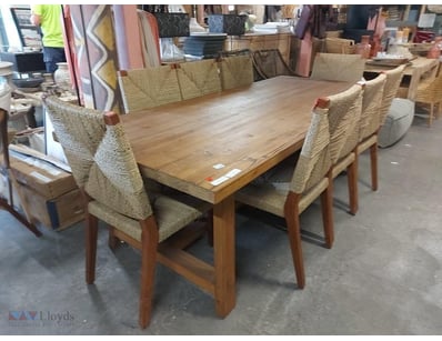Rustic timber dining suite featuring a solid wood ...