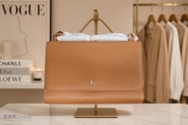 37 · Woman's leather handbag with dustcover, Aje