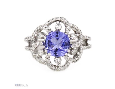 14K WHITE GOLD, TANZANITE AND DIAMOND, FLORAL RING...
