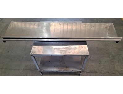 Metal table with separate shelving units

Approx...