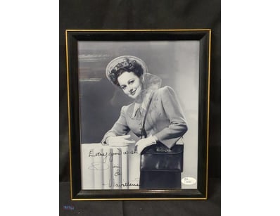 AUTOGRAPHED PHOTOGRAPH OF OLIVIA DE HAVILLAND.

It...