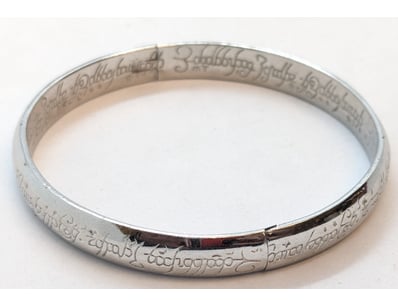 LORD OF THE RINGS SILVER BANGLE

Condition: Good...