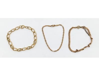 two 9k yellow gold chain bracelets and faux gold c...