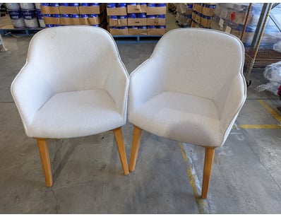 Pair of contemporary upholstered armchairs featuri...