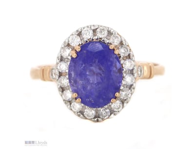 14K ROSE GOLD, TANZANITE AND DIAMOND, HALO RING.  ...