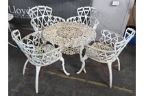5305 · White cast-metal patio set features an intricate,
