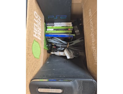 Xbox 360 gaming console bundle featuring a black E...