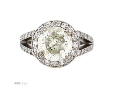 950 PLATINUM AND DIAMOND, HALO SPLIT BAND RING.   ...