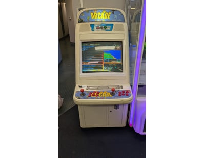 Vintage arcade cabinet featuring classic multi-gam...
