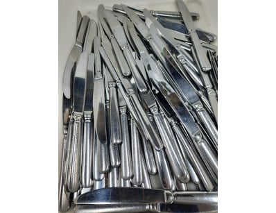 Container of sliver knives.

Unknown quantity.
...