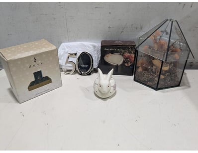 Curated collection of decorative homeware items fe...