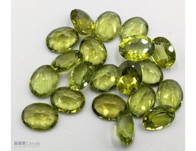 TWENTY OVAL CUT GREEN PERIDOTS

Total Carat Weight...