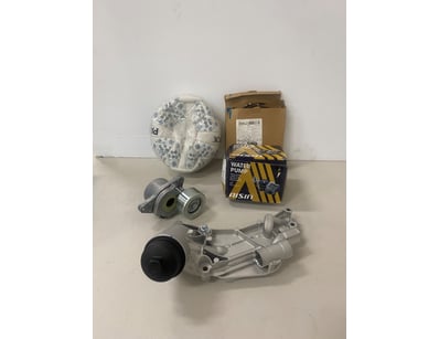 Box of assorted items including water pump, ball, ...