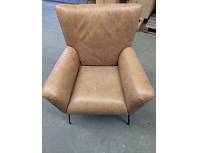 Modern wingback armchair upholstered in cognac-ton...