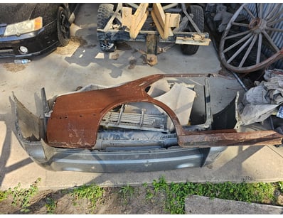 Assorted car parts, including bumper, side panel

...