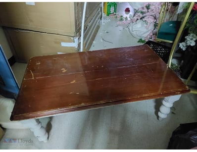 Vintage wooden coffee table featuring a rich mahog...