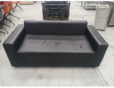 Modern black leather two-seater sofa featuring cle...