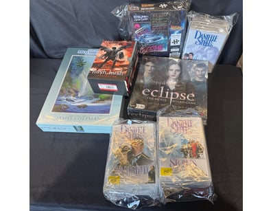 Collectible media bundle featuring sealed and unop...