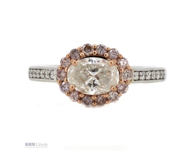 THE CENTRE FEATURES, ONE OVAL BRILLIANT CUT, DIAMO...