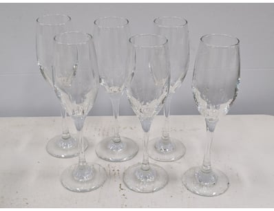 Set of six champagne flutes featuring elegant tape...