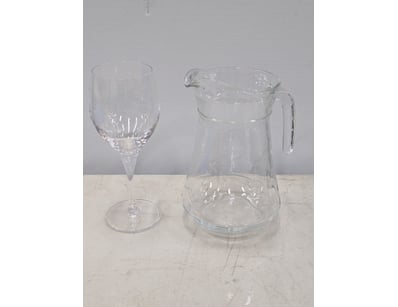 Wine glasses and glass jugs in tray 

SOLD AS LO...