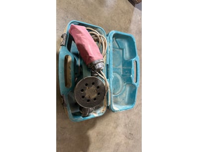 Vintage blue plastic toolbox case containing an or...