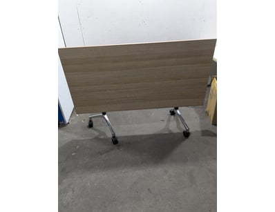 Mobile flip-top training table featuring a light o...