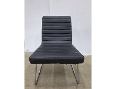 Modern black lounge chair featuring horizontal cha...