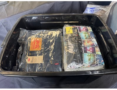 Assorted box of pants and shirts in various sizes ...