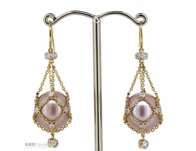 THE DESIGN FEATURES, 2 NEAR ROUND PINK WITH SILVER...