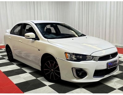 <b>2016 Mitsubishi Lancer - White - 141,699km - 4-...