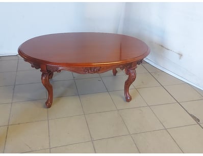 Timber Oval shaped coffee table with carved legs.
...