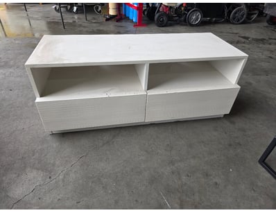 Modern white entertainment unit featuring two open...