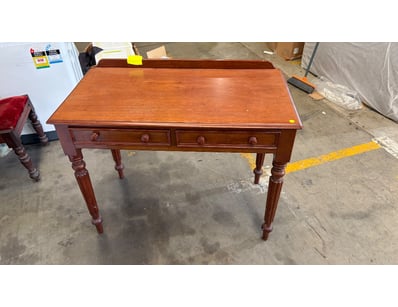 Timber style writing desk with a warm honey-to-red...