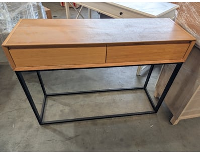 Modern console desk featuring a light oak wood top...
