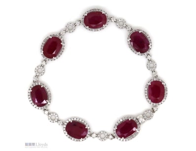 14K WHITE GOLD, RUBY AND DIAMOND, HALO BRACELET.  ...