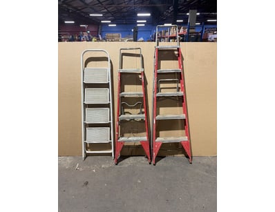 Lot of three step ladders in varying conditions. I...