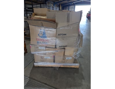 Assorted PPE safety gear including blue work pants...