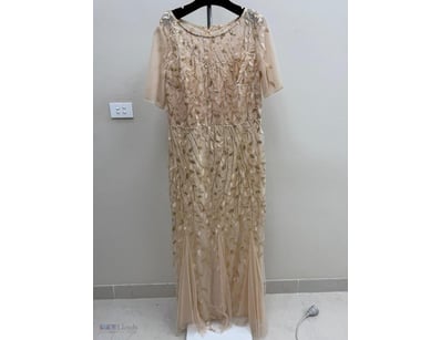 BEADED EVENING GOWN WITH LEAF MOTIF

Item Size: He...