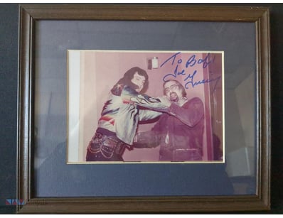 AUTOGRAPHED PHOTOGRAPH OF ELVIS PRESLEY INTERACTIN...