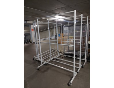 Industrial-grade mobile garment rack system featur...
