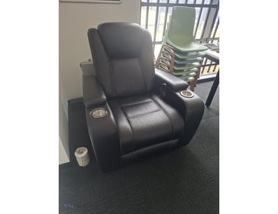 Premium black leather reclining chair featuring mo...