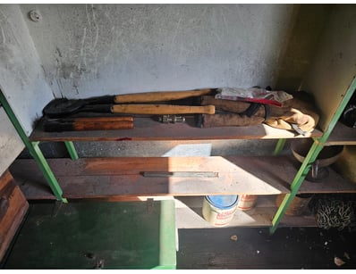 Rack with assorted tools, including horn cutter, c...