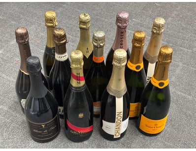 A curated collection of twelve premium champagne a...