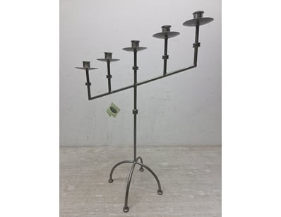 Industrial-style wrought iron style candelabra fea...